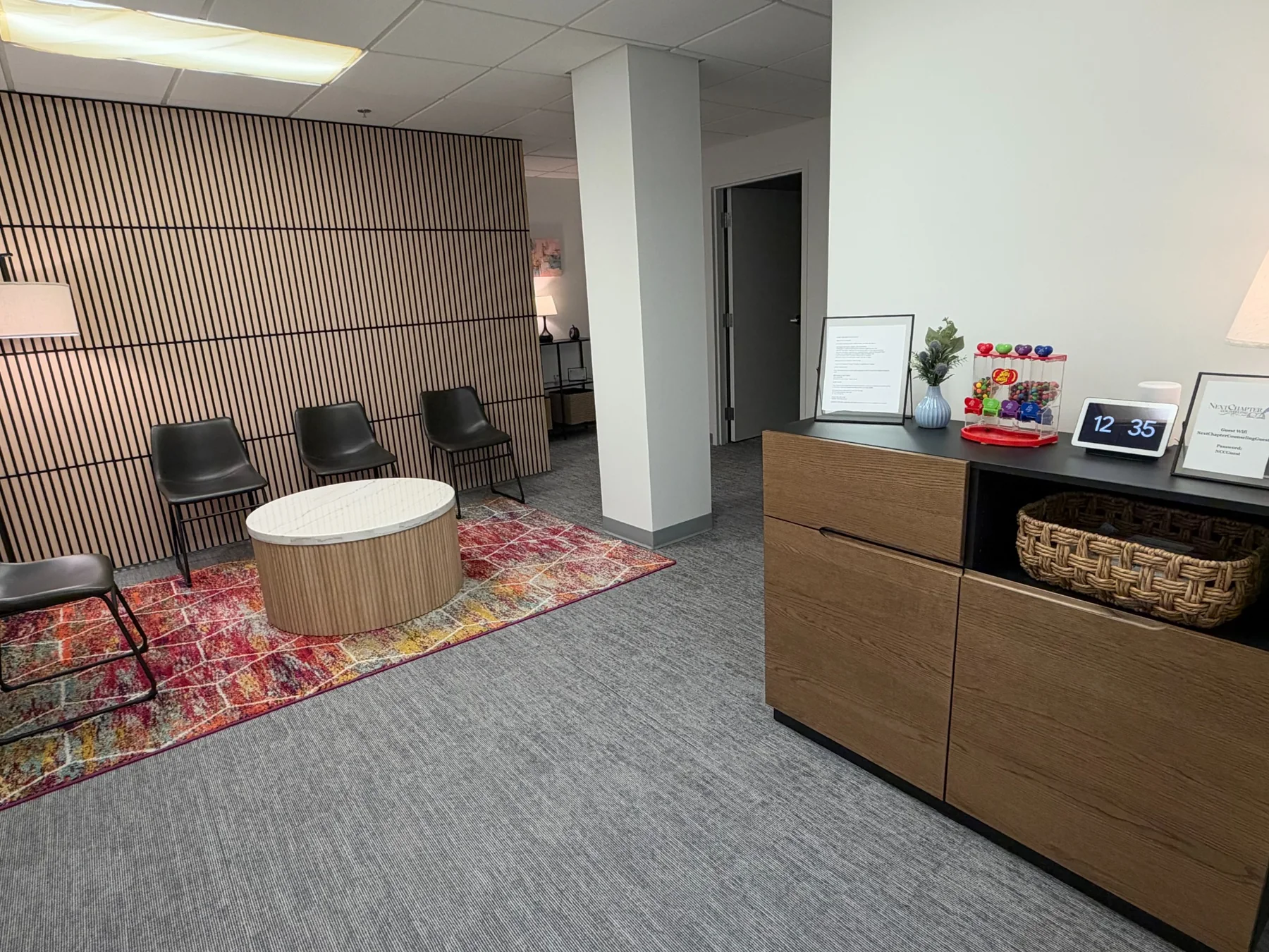 NextChapter Counseling waiting area with a wood slat feature wall and seating